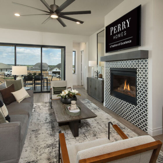 Perry Home living room with collapsible patio doors for entertaining.