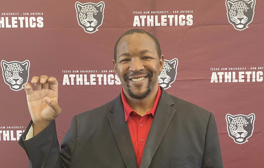 Darnell Smith holds up the Jaguar paw