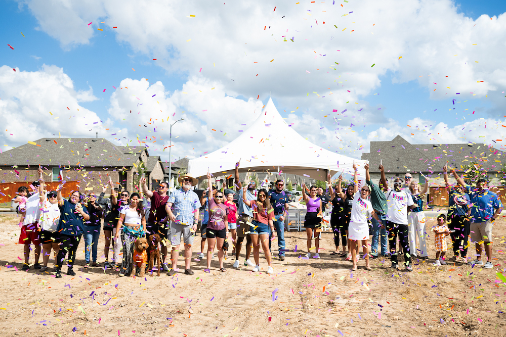 VIDA San Antonio Homeowners throw confetti in the air to celebrate the groundbreaking of the community pool & clubhouse.