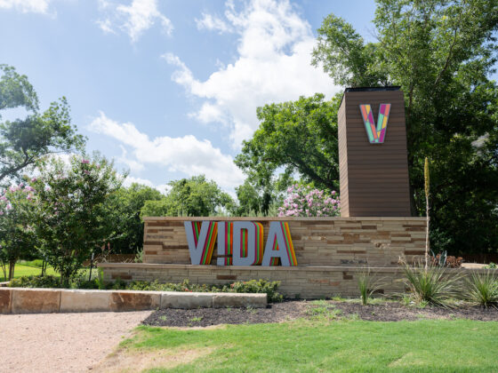 VIDA Entrance Sign against a blue sky