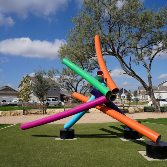 A VIDA San Antonio park features a piece of public art with colorful curved tubes in San Antonio.