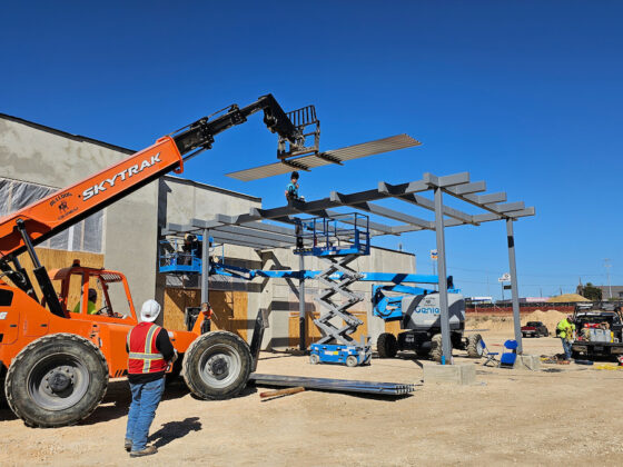 As University Health Wheatley construction progresses, construction crews work on the Main Entry Canopy, placing the metal deck with cranes.