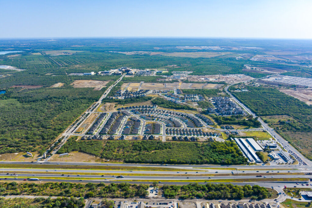 Aerial view of the VIDA San Antonio Community, A&M-San Antonio in the background