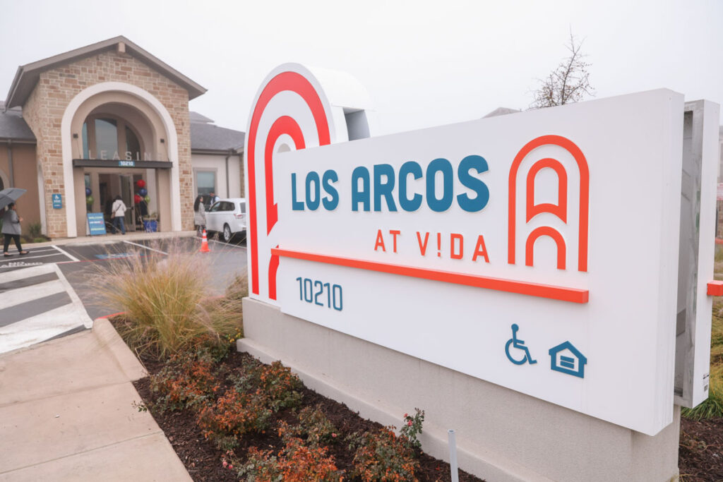 The Los Arcos sign at VIDA in front of the leasing office.