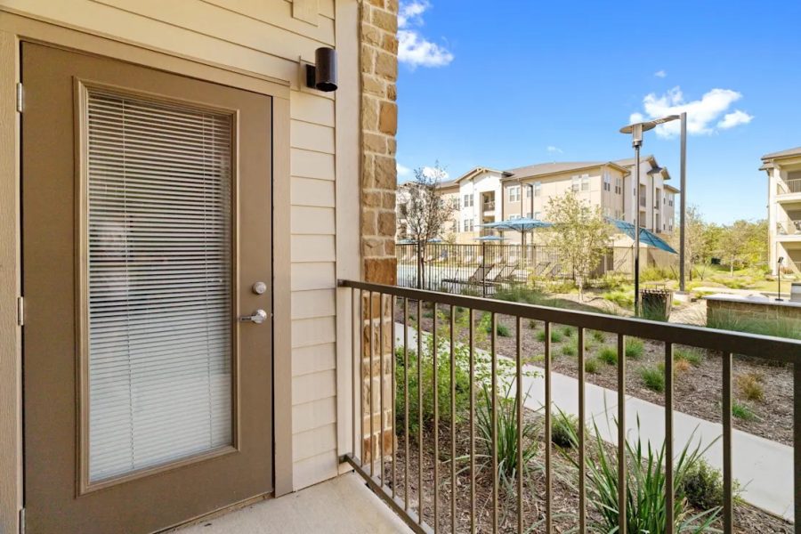 A patio view from an apartment at Los Arcos in South San Antonio